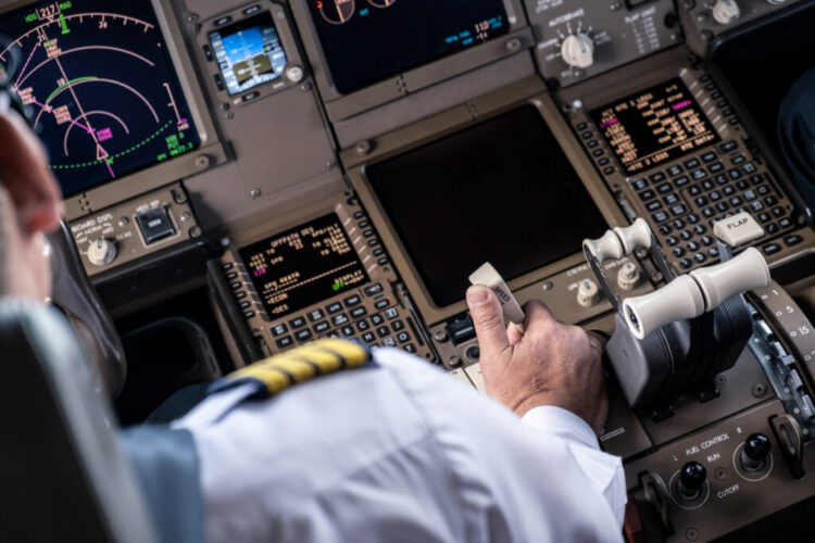 airliner-captain-controlling-airplane-cockpit-pulling-spreed-brake-lever-slow-down-aeroplane-speed